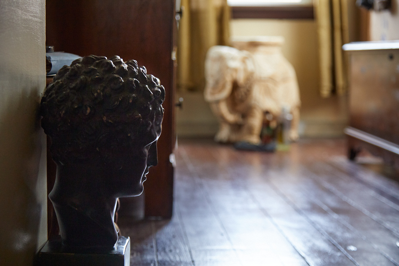 A photo of a bust on the floor. Interior Photographer Baltimore, MD