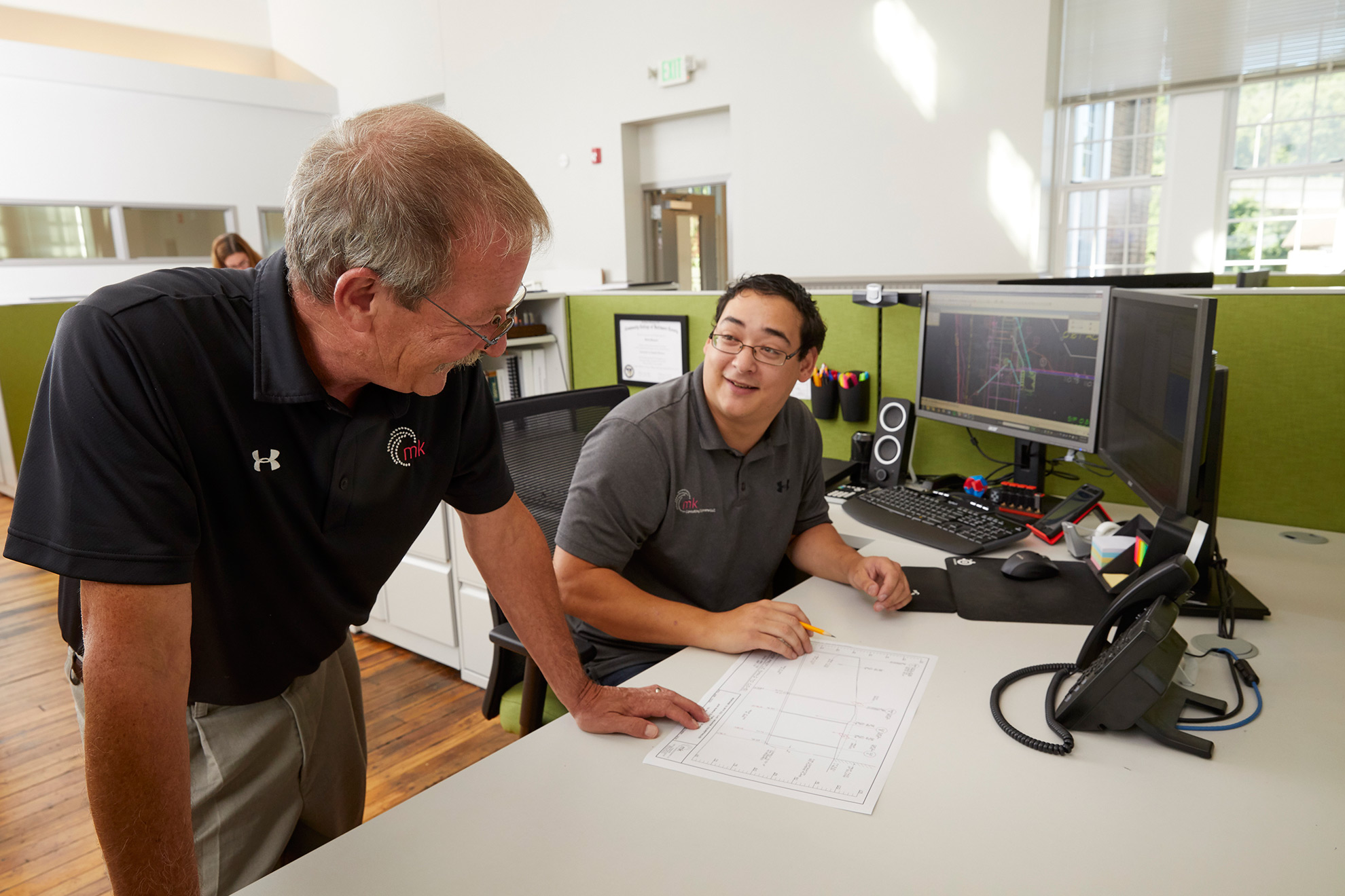 Two men in an office working photographed by Maryland Corporate Photographer Tracey. Brown