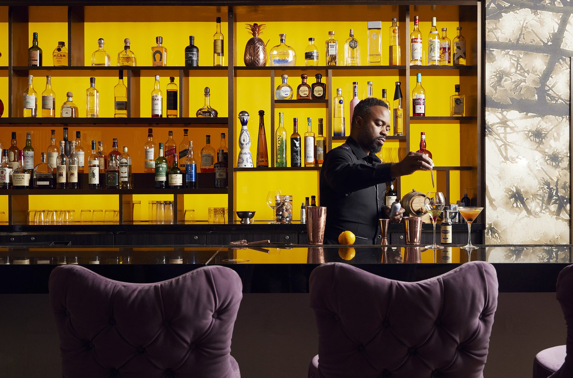 Bartender mixing a drink. Photo by Baltimore Commercial Photographer Papercamera