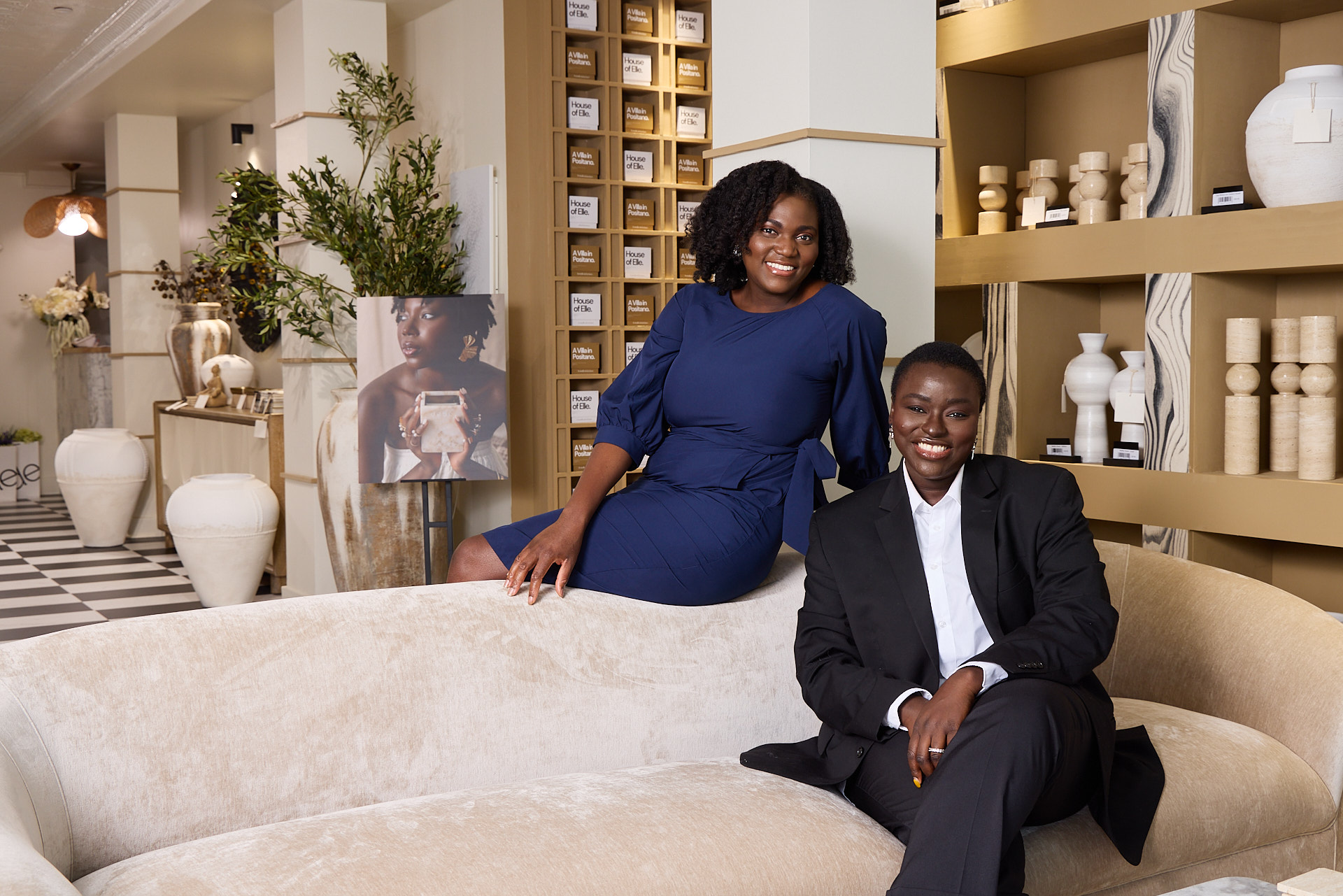 Two women in a store smiling. Photo by Baltimore Editorial and commercial portrait photographer Tracey Brown of Papercamera