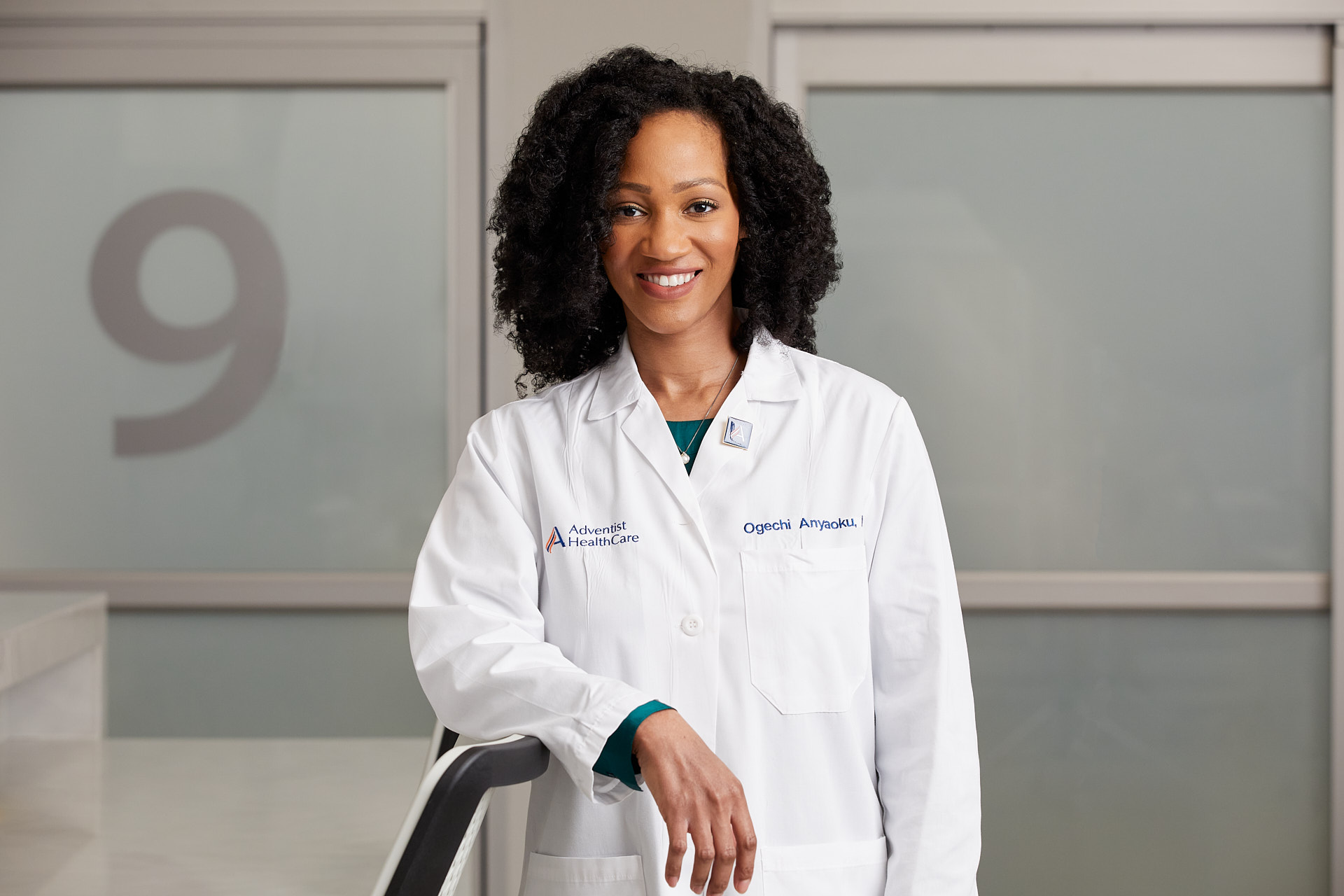 A doctor smiiing at the camera. Photo by Washington DC healthcare photographer Tracey Brown of Papercamera